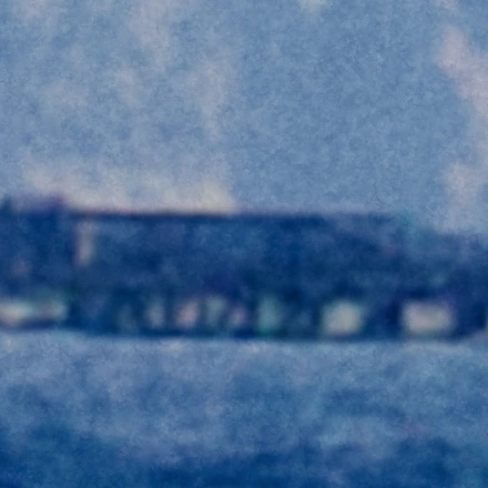 Very small, faint grain.